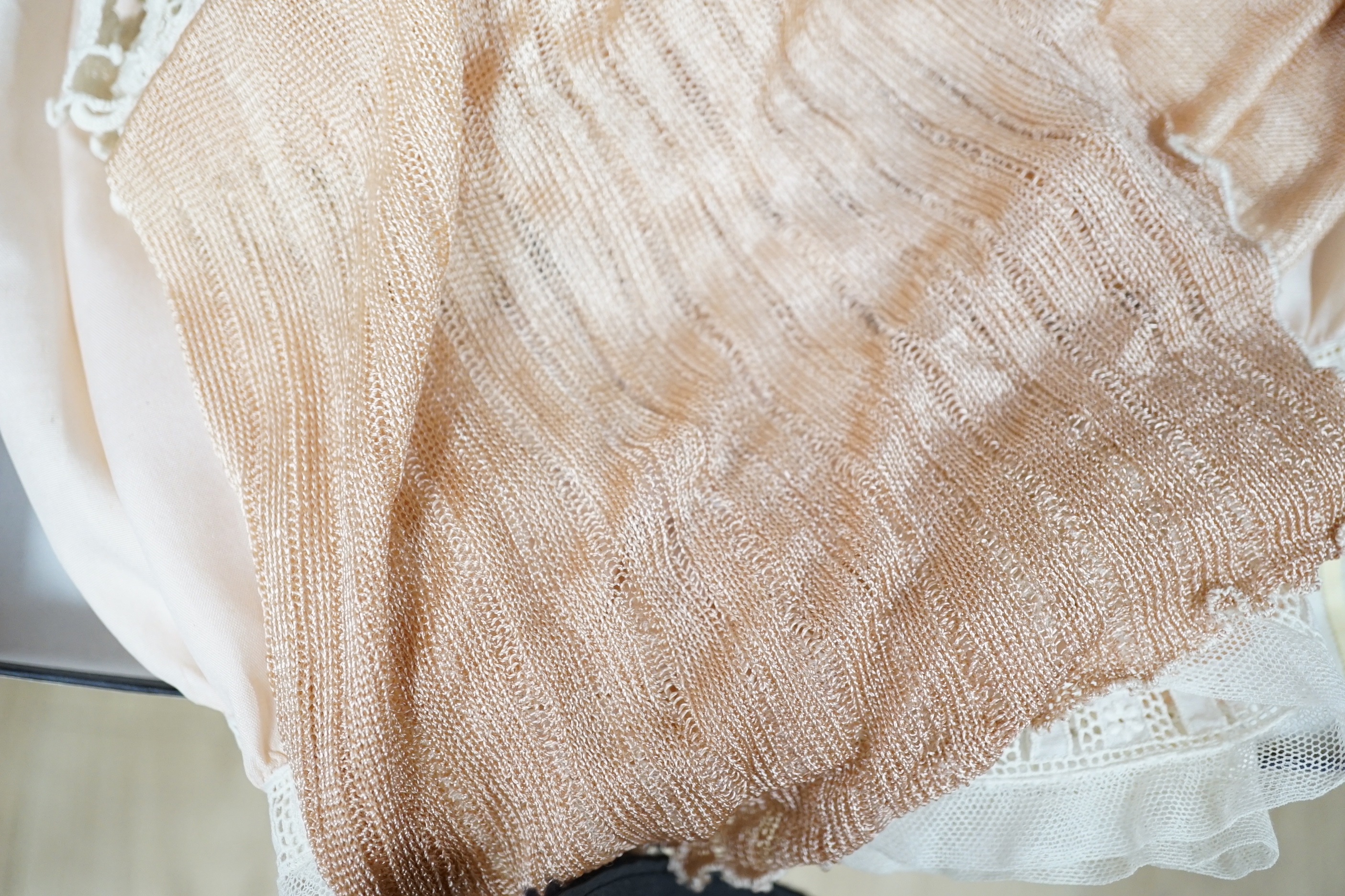 Two Edwardian pink silk and lace inserted camisole tops, a fine 1920’s blouse, a chemise and a pink silk knitted scarf, a bobbin lace collar and length of trimming